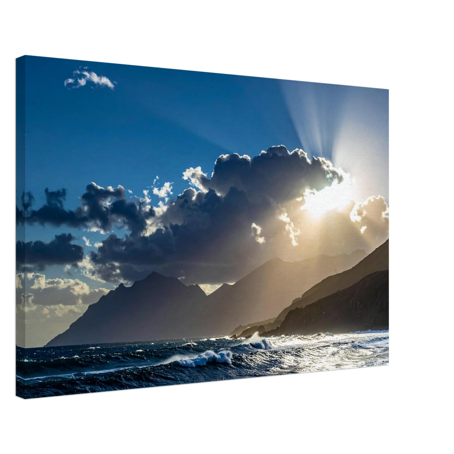 Sunrise over mountains with clouds and ocean waves