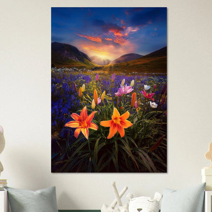 Vibrant orange and white lilies in a purple flower field with mountains and a glowing sunset in the background.