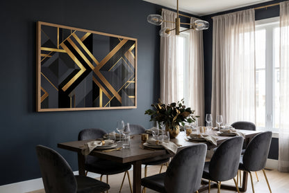 Modern black and gold geometric framed poster wall art in elegant dark navy dining room