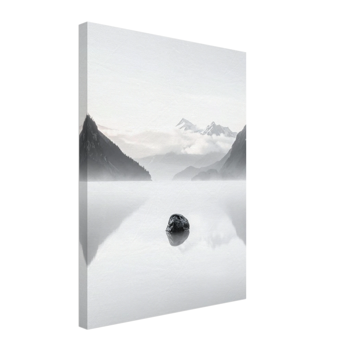 Framed photograph of a mountain landscape with a lake and rock in the foreground.